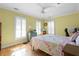 Bright bedroom with hardwood floors, shuttered windows, and a ceiling fan offering natural light at 1143 Morningside Ne Pl, Atlanta, GA 30306