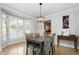 Cozy dining room featuring white shutters, a bay window, and a stylish chandelier at 1143 Morningside Ne Pl, Atlanta, GA 30306