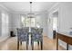 Elegant dining room with hardwood floors, stylish chairs, and a modern light fixture at 1143 Morningside Ne Pl, Atlanta, GA 30306