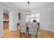 Charming dining room with hardwood floors, a modern chandelier, and an open layout at 1143 Morningside Ne Pl, Atlanta, GA 30306