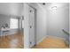 Bright hallway with hardwood floors, a closet, and views into a bedroom at 1143 Morningside Ne Pl, Atlanta, GA 30306