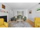 Open living room with a fireplace, hardwood floors, and access to the dining area at 1143 Morningside Ne Pl, Atlanta, GA 30306