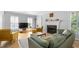 Comfortable living room featuring a fireplace, hardwood floors and a large TV at 1143 Morningside Ne Pl, Atlanta, GA 30306