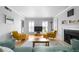 Bright living room with a fireplace, hardwood floors, and comfortable seating at 1143 Morningside Ne Pl, Atlanta, GA 30306
