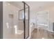 Bright bathroom featuring a soaking tub and a glass enclosed shower at 174 Pinewood Dr, Covington, GA 30014