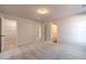 Spacious bedroom showcases neutral carpeting, light walls and access to other rooms in the house at 174 Pinewood Dr, Covington, GA 30014