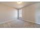 Bedroom features neutral walls, carpet and a window offering a view to the outdoors at 174 Pinewood Dr, Covington, GA 30014