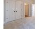 This bedroom has carpet, light walls and views into other rooms through white doors at 174 Pinewood Dr, Covington, GA 30014