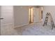 Bedroom featuring closet, neutral walls, carpet and a ladder leaning against the wall at 174 Pinewood Dr, Covington, GA 30014