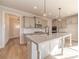 Modern kitchen with granite countertops, stainless steel appliances, and a spacious island at 174 Pinewood Dr, Covington, GA 30014
