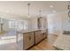 Open kitchen featuring a large island, stainless steel appliances, and hardwood floors at 174 Pinewood Dr, Covington, GA 30014