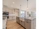 Modern kitchen with granite countertops, island with sink, and stainless steel appliances at 174 Pinewood Dr, Covington, GA 30014