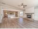 Open-concept living room and kitchen features a fireplace and hardwood floors at 174 Pinewood Dr, Covington, GA 30014