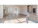 Open concept living area featuring hardwood floors, fireplace, and lots of natural light at 174 Pinewood Dr, Covington, GA 30014