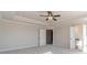 Large main bedroom featuring tray ceilings, neutral paint, and plush carpeting at 174 Pinewood Dr, Covington, GA 30014