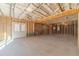 Unfinished basement features a door and exposed beams, ready for customization at 174 Pinewood Dr, Covington, GA 30014