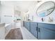 Spacious bathroom features a double vanity, soaking tub, and a view of the outdoors at 185 Paislee Park (Lot #10 Paislee Park) Dr, Fayetteville, GA 30215