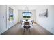 Cozy dining room with a round table, chandelier, and lots of natural light at 185 Paislee Park (Lot #10 Paislee Park) Dr, Fayetteville, GA 30215