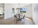 Bright dining room featuring a round table, stylish chandelier, and a view of the outdoors at 185 Paislee Park (Lot #10 Paislee Park) Dr, Fayetteville, GA 30215