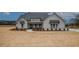 Beautiful single-story home with light gray siding, a gray roof, and a well-manicured lawn at 185 Paislee Park (Lot #10 Paislee Park) Dr, Fayetteville, GA 30215