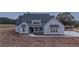 New home with grey siding, dark roof and a concrete driveway and walkway at 185 Paislee Park (Lot #10 Paislee Park) Dr, Fayetteville, GA 30215
