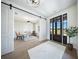 Sunlit home office with sliding barn door, bright lighting and glass paneled wall at 185 Paislee Park (Lot #10 Paislee Park) Dr, Fayetteville, GA 30215