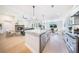 The kitchen features a large island, modern cabinets, stainless appliances and an open plan at 185 Paislee Park (Lot #10 Paislee Park) Dr, Fayetteville, GA 30215
