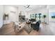 Bright living room featuring a stone fireplace, plush seating, and large windows offering natural light at 185 Paislee Park (Lot #10 Paislee Park) Dr, Fayetteville, GA 30215