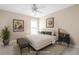 Bright staged bedroom with neutral walls, plush carpet, white ceiling fan, and natural light at 195 Finchley Dr, Roswell, GA 30076