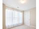 Sun-filled bedroom with neutral walls, white trim, plush carpet, and lots of natural light at 195 Finchley Dr, Roswell, GA 30076