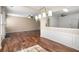 Bright dining room featuring hardwood floors, modern lighting, and wainscoting details that add character at 195 Finchley Dr, Roswell, GA 30076