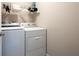 Practical laundry room setup with modern washing machine and dryer ready for everyday convenience at 195 Finchley Dr, Roswell, GA 30076