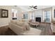 Living room featuring a fireplace, ceiling fan, and plush sectional sofa at 195 Finchley Dr, Roswell, GA 30076
