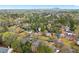 Aerial view of a home nestled in a lush, wooded neighborhood, highlighting its serene setting at 3993 Amberley Ln, Marietta, GA 30062