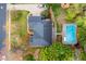 Aerial view of the house showcasing its roof, pool, landscaping, and surrounding neighborhood at 3993 Amberley Ln, Marietta, GA 30062