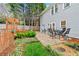 Backyard with an outdoor dining set and a walkway to the fenced in pool area at 3993 Amberley Ln, Marietta, GA 30062