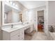 Bright bathroom with double vanity, ample counter space, and a door leading to the walk-in closet at 3993 Amberley Ln, Marietta, GA 30062
