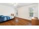 Sunlit bedroom with hardwood floors and two windows at 3993 Amberley Ln, Marietta, GA 30062