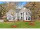Charming two-story traditional home with gray siding, white trim, and manicured front yard at 3993 Amberley Ln, Marietta, GA 30062