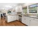 Bright kitchen featuring white cabinets, granite countertops, stainless steel appliances, and an eat-in area at 3993 Amberley Ln, Marietta, GA 30062