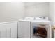 Bright laundry room featuring a washer and dryer at 3993 Amberley Ln, Marietta, GA 30062