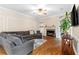 Spacious living room with a fireplace, hardwood floors, large windows, and a comfortable seating area at 3993 Amberley Ln, Marietta, GA 30062