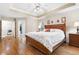 Main bedroom featuring a trey ceiling, hardwood floors, and an ensuite bathroom with laundry access at 3993 Amberley Ln, Marietta, GA 30062