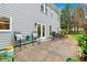 Charming patio area with outdoor seating, plants, and a view of the landscaped backyard at 3993 Amberley Ln, Marietta, GA 30062