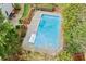 Aerial view of a sparkling backyard pool with concrete surround and lush landscaping at 3993 Amberley Ln, Marietta, GA 30062