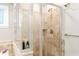 Walk-in shower with glass door and decorative tile at 3993 Amberley Ln, Marietta, GA 30062
