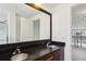 Bathroom with dual sink vanity, dark countertops, and a large mirror, offering a modern and functional space at 747 Ralph Mcgill Ne Blvd # 337, Atlanta, GA 30312