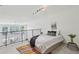Bedroom featuring neutral carpet, bright white walls, black metal railing and a colorful area rug at 747 Ralph Mcgill Ne Blvd # 337, Atlanta, GA 30312