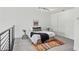 Bedroom featuring neutral carpet, bright white walls, black metal railing and a colorful area rug at 747 Ralph Mcgill Ne Blvd # 337, Atlanta, GA 30312