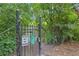 Dog park entrance gate with clear signage, lush green surroundings, and secure fencing at 747 Ralph Mcgill Ne Blvd # 337, Atlanta, GA 30312